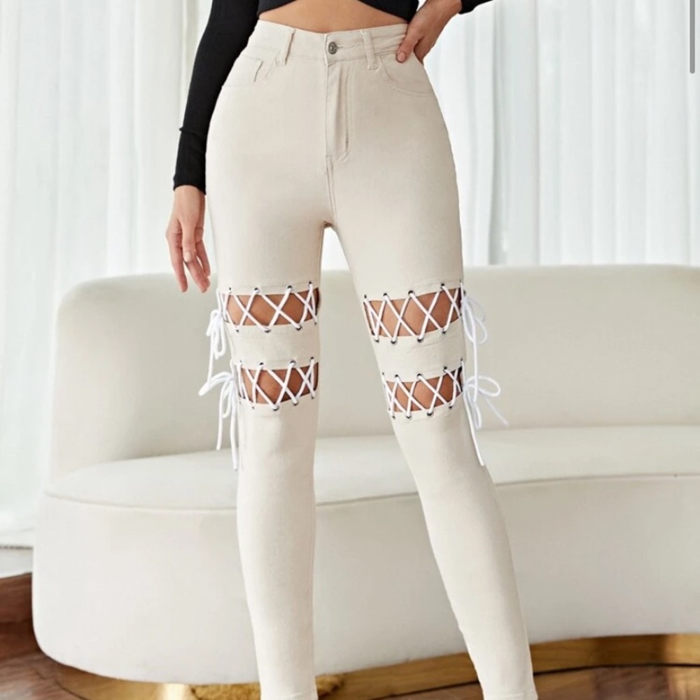 Tan jeans with white tie